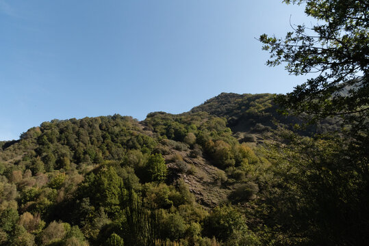 Formigueiros peak Courel hillside with autumn sunlight and blue sky