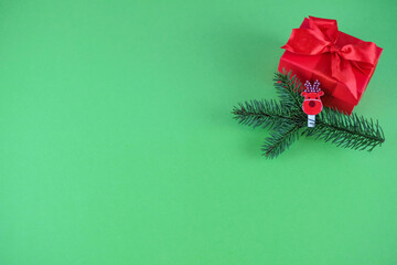 Christmas and New Year background, Christmas gift, fir leaves, green background, top view