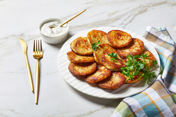 Potato pancakes on a light marble background