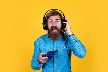 bringing game to Everyone LIfe. digital living. hipster with console. bearded man wearing...