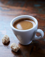 Cup of coffee on rustic wooden background. Close up.	