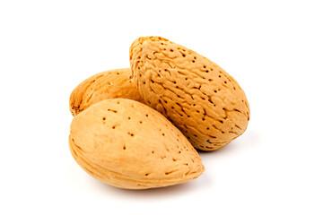 almond nuts in close-up, isolated on white background