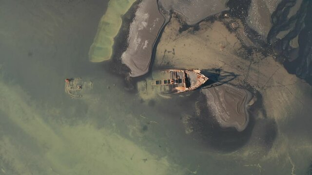 Orbiting descend into FV Clyne Castle Steam Trawler Wreck - Breidamerkursandur in South Iceland - Drone Cinematic Footage