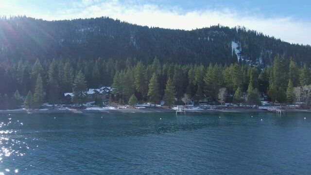 Drone Truck over Lake Tahoe Fast Northern California Winter Snow Capped Mountains
