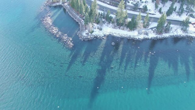 Lake Tahoe Lakeside Real Estate And Docks Over Beautiful Crystal Clear Blue Lake On A Sunny Winter Day