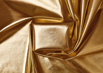Golden draped textile with empty podium for background
