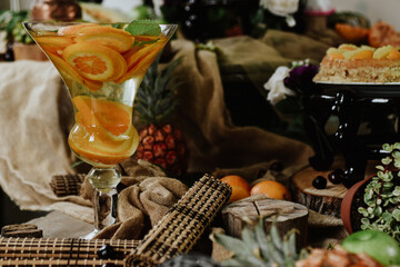 still life with wine and fruits. Table with all kinds of tropical fruits