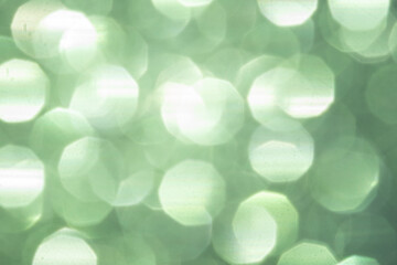 blurred festive emerald green glitter bokeh background