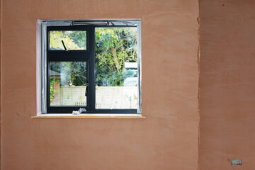 Brown plastered walls in the property, preparation for the paint, selective focus