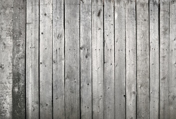 Wooden wall or fence made of unpainted boards