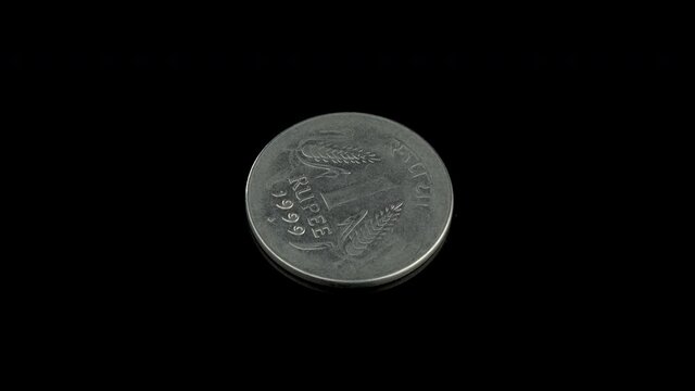 Indian 1 rupee of 1999 coin on a black background