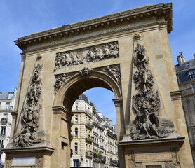 Obraz premium Porte Saint-Denis, triumphal arch erected by Louis XIV on 1672. Paris, France.