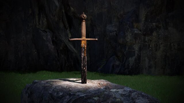 A close-up view of the sword in the stone as viewed under a spotlight at night.