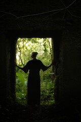 A young girl in an old ruined Fort. India