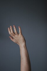 Hand woman minimalism blue backdround feelings emotions by hand and fingers