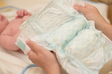 Cute baby having bath in white tub