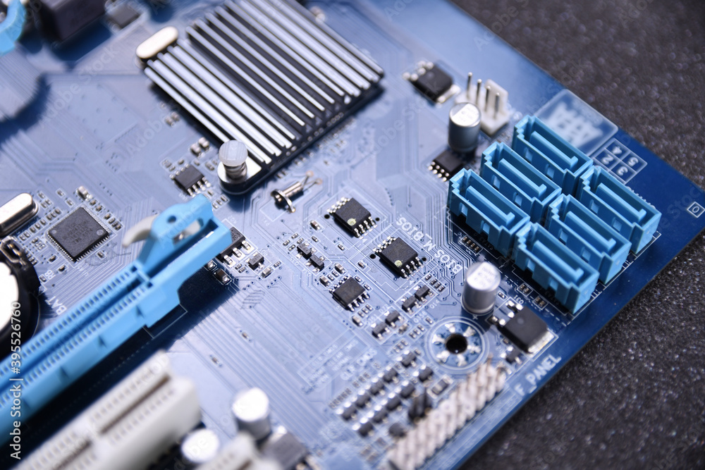 Poster computer fan on motherboard and electronical components cpu gpu memory and different sockets for vid