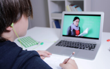 students at home studying with online learning