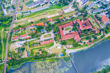 Fototapeta premium Aerial view of Malbork Teutonic order castle in Poland. It is the largest castle in the world measured by land area and a UNESCO World Heritage Site, built in 13th-century.