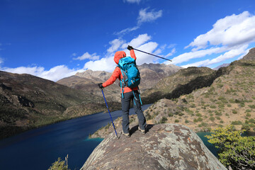 Woman backpacker hiking  in beautiful winter mountains