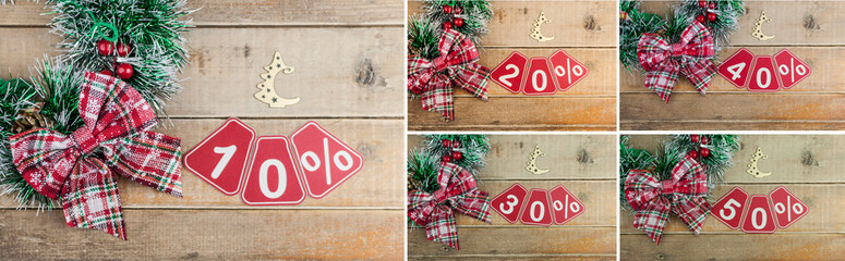 Set of 10-50 percent discount signs on a old plank background, top view, copy space. Christmas big...