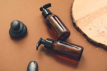 Cosmetic bottles on color background