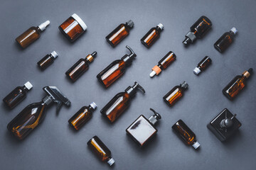 Composition with cosmetic bottles on dark background