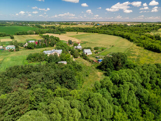 Top view of rural houses surrounded by fields in central Russia