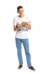 Young man with books on white background