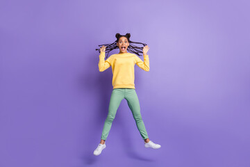 Fototapeta na wymiar Full size photo of scared girl jump yell wear yellow shirt trousers sneakers isolated on lilac color background