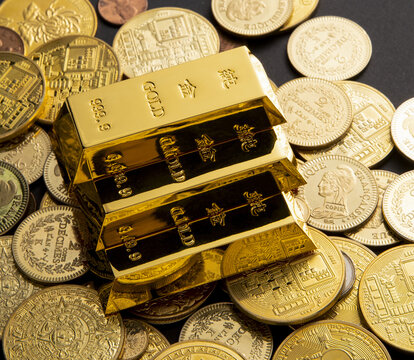 Closeup Shot Of Shiny Gold Bars And Coins