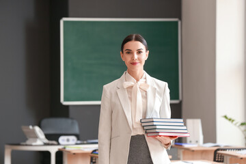 Portrait of female teacher in classroom