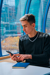 Young attractive student talking on the phone.