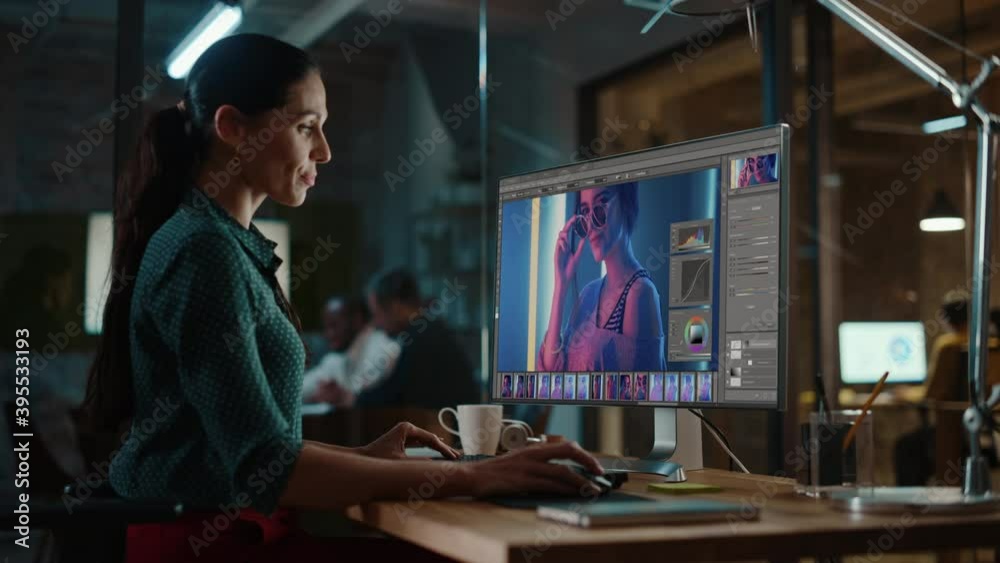 Poster Middle Aged Multiethnic Specialist Working on Desktop Computer in Creative Office Environment. Beautiful Diverse Female is Editing a Fashion Photograph with Model in Digital Graphics Editing Software.