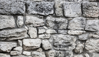 Stones in the wall of the house as an abstract background.