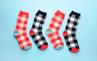 Warm socks on color background