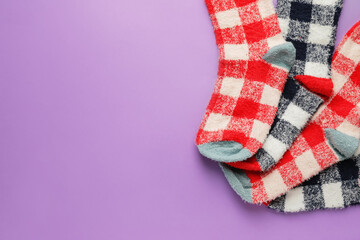 Warm socks on color background