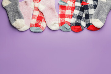 Warm socks on color background