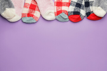 Warm socks on color background