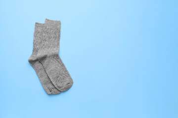 Warm socks on color background