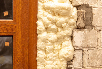 Construction foam between the wall and the door.