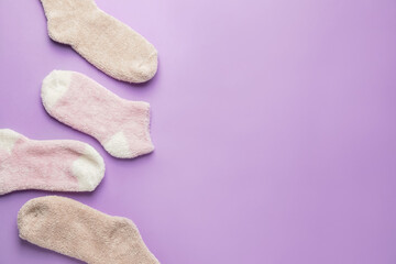 Warm socks on color background