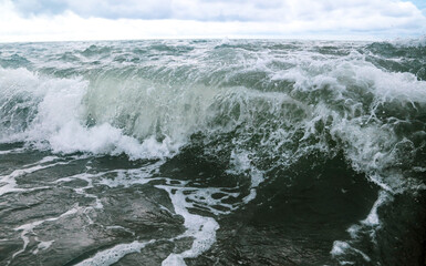 Wave in the sea with splashing water.