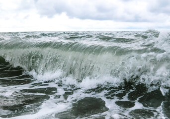 Wave in the sea with splashing water.