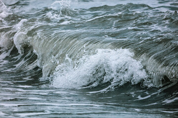 Wave in the sea with splashing water.