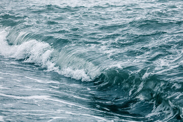 Wave in the sea with splashing water.