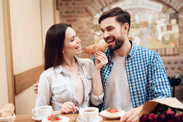 Happy Young Couple Have Date in Modern Cafeteria.