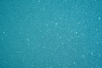 Blue Sparkling Lights Festive background with texture. Abstract Christmas twinkled bright Falling stars. Winter Card or invitation