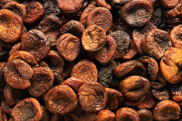 Dark brown dried apricots. Safe, natural sweets for the child