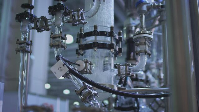 Water pump and pipes. Transparent pipe to show water flows inside the water supply system.